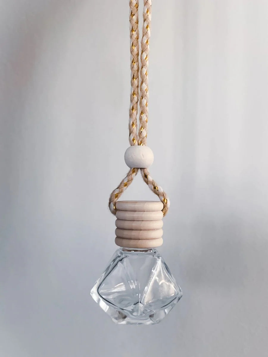Glass pendant with wooden accents on a neutral background